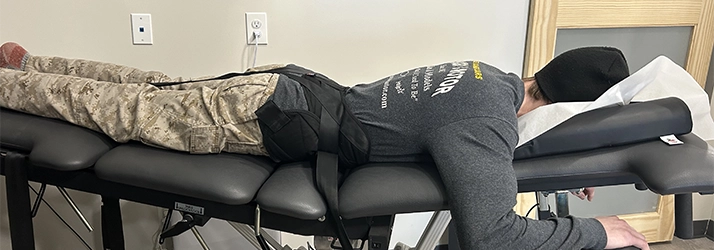 A spinal decompression patient laying face down on a table.